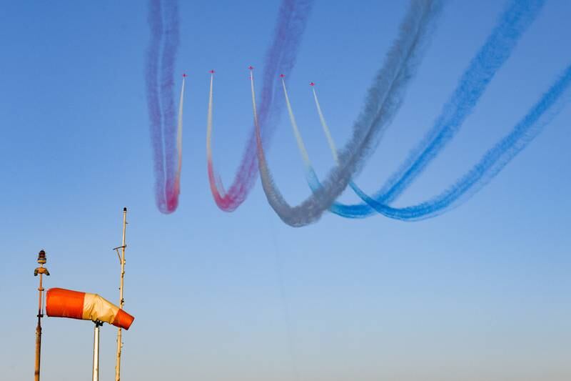 The Red Arrows perform aerial manoeuvres above the skies of Kuwait City. EPA