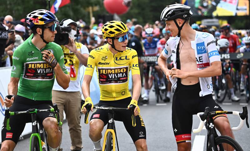 Wout Van Aert, wearing the sprinter's green jersey, alongside his Jumbo-Visma teammate and race leader in yellow Jonas Vingegaard and UAE Team Emirates' rider Tadej Pogacar in the best young rider's white jersey at the start of Stage 12. AFP