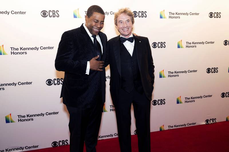 Comedians Kenan Thompson and Martin Short share a laugh. AP
