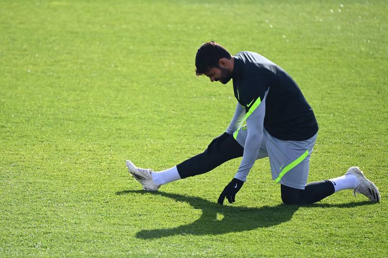 Atletico striker Diego Costa stretches during training. AFP