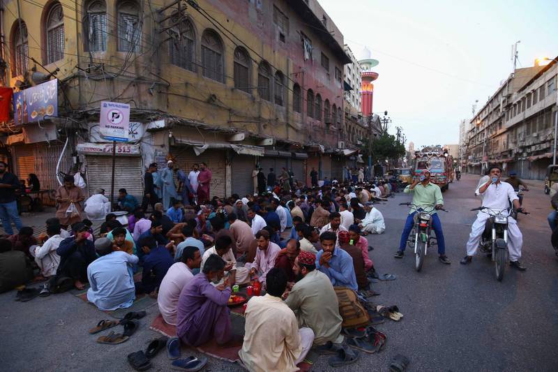 People break their fast in Karachi, Pakistan. EPA