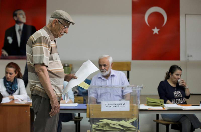 A man casts his ballot for Turkey's presidential and parliamentary elections at a polling station in Ankara, Turkey, on June 24, 2018. Stoyan Nenov / Reuters