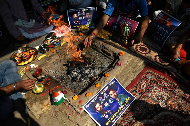 Cricket fans pray for an India victory in New Delhi. AFP