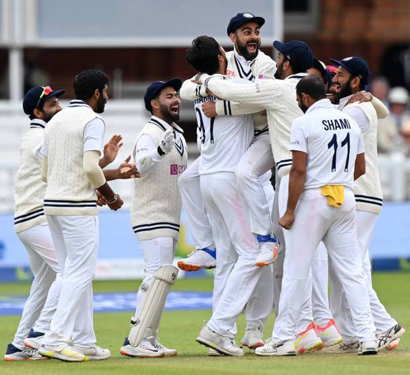 India celebrate after the successful appeal for the wicket of England's Jonny Bairstow.