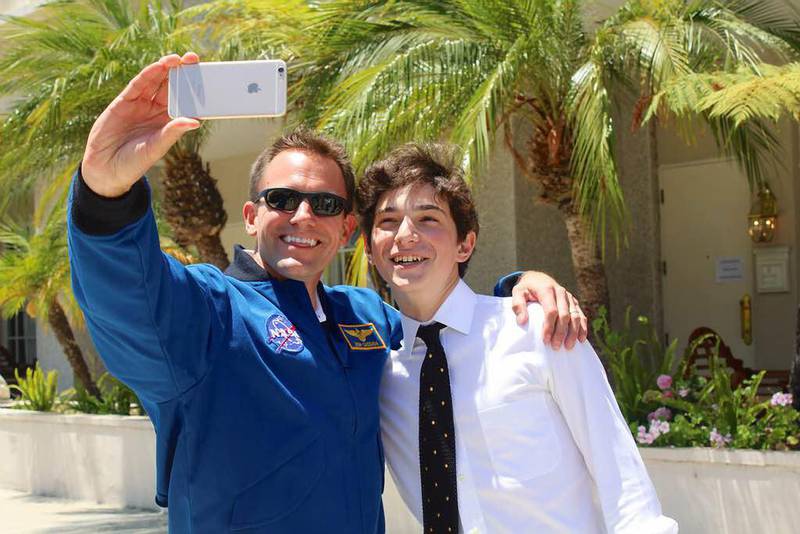 Julian Rubinfien, 16, winner of Genes in Space’s US version, met the Nasa astronaut Josh Cassada Courtesy Julian Rubinfien