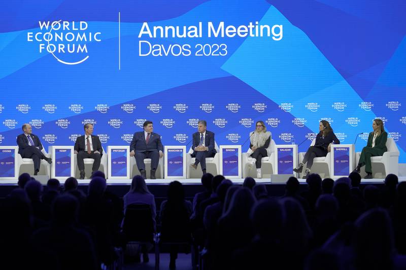 US governors Brian Kemp and JB Pritzker, senators Chris Coons, Joe Manchin and Kyrsten Sinema and representatives Maria Salazar and Mikie Sherrill take part in a panel discussion at Davos. AP