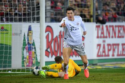 Robert Lewandowski of Bayern Munich celebrates scoring the opening goal. Getty