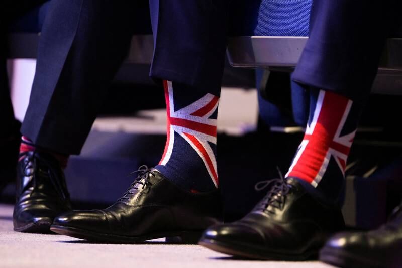 A member of the audience wears socks with Union Jack colours. Reuters