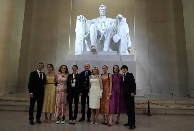US President Joe Biden and First Lady Jill Biden pose with their family in front of the statue of Abraham Lincoln during the 'Celebrating America' event at the Lincoln Memorial. Reuters