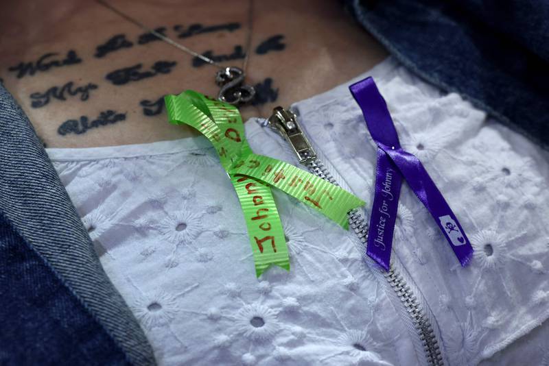A fan of Depp wears ribbons in a show of support. AFP