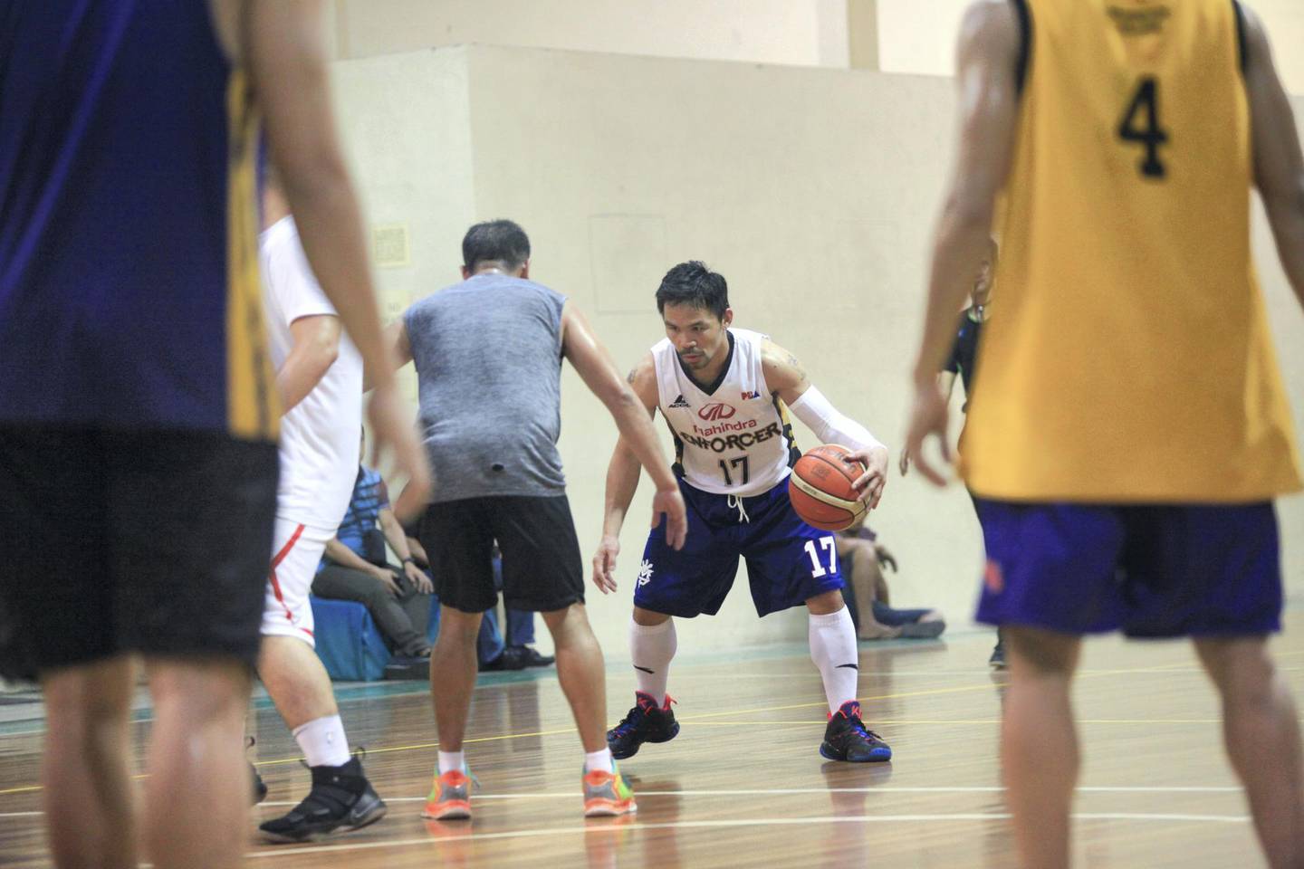 Eight-division boxing champion and Philippine Senator Manny Pacquiao plays a few games of basketball as an alternative to his regular boxing training routine in Paranaque, Metro Manila.