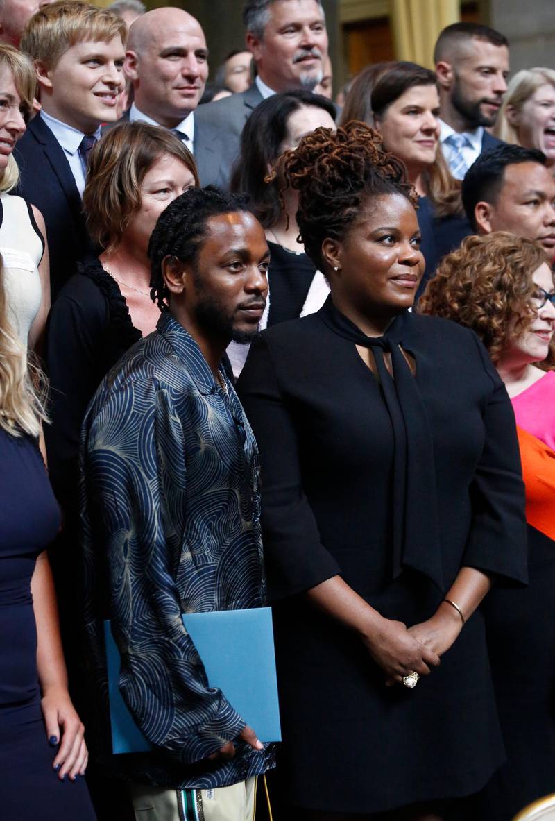 Pulitzer Prize winner for music Kendrick Lamar, left front, stands next to the winner for feature writing GQ freelancer Rachel Kaadzi Ghansah. AP