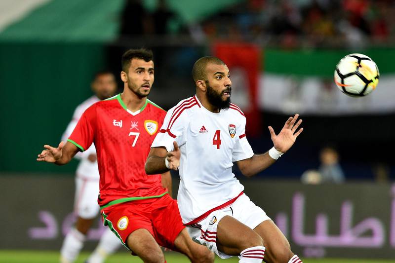Oman, in red, battled to a 0-0 draw against UAE in the final of the Gulf Cup. Noufal Ibrahim / AFP