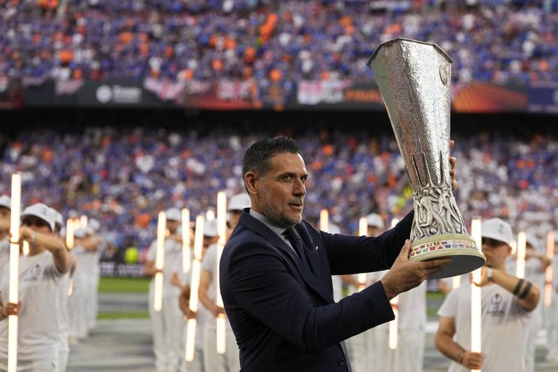 Former Sevilla goalkeeper Andres Palop carries the trophy before the Europa League final. AP