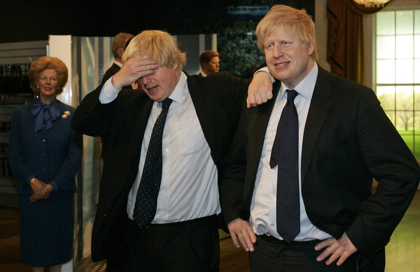 Then mayor of London Boris Johnson poses with a wax figure of himself at Madame Tussauds wax museum in London in 2009. AP Photo