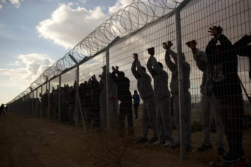 African migrants at the Holot detention centre. Tens of thousands from Eritrea and Sudan living in Israel have been detained or ordered to report to a detention centre. Oded Balilty / AP Photo