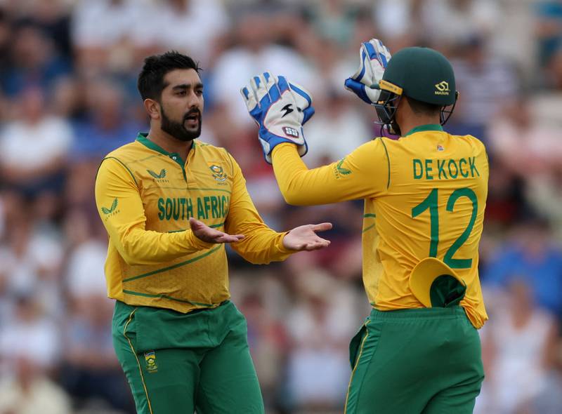 South Africa's Tabraiz Shamsi celebrates with Quinton de Kock after taking the wicket of England's Chris Jordan. Reuters