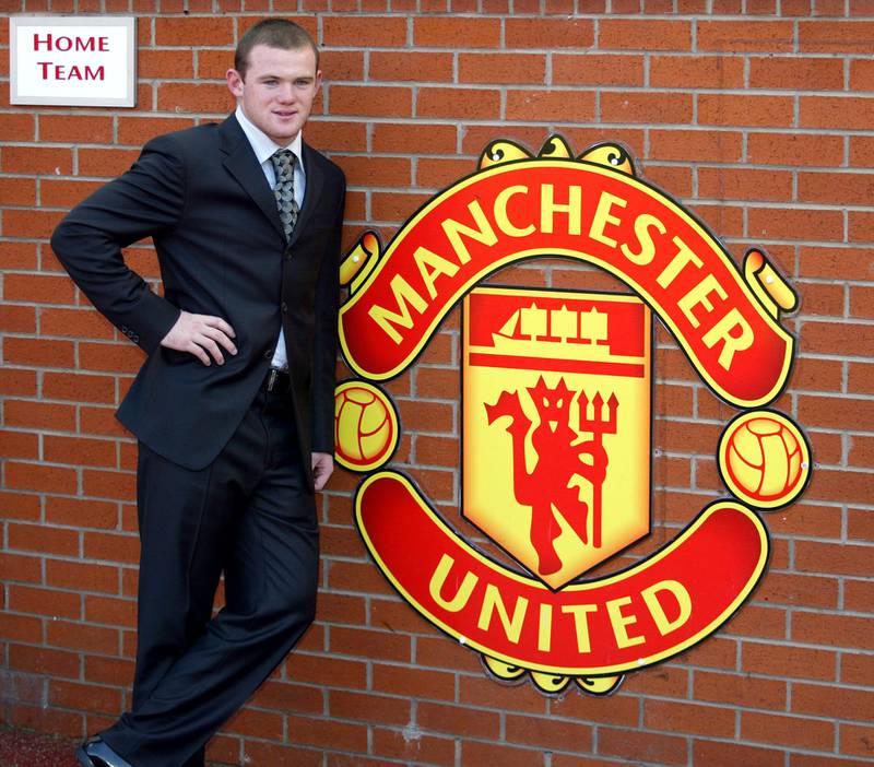 Manchester United's new signing Wayne Rooney poses for photographers at Old Trafford on September 1, 2004. AFP