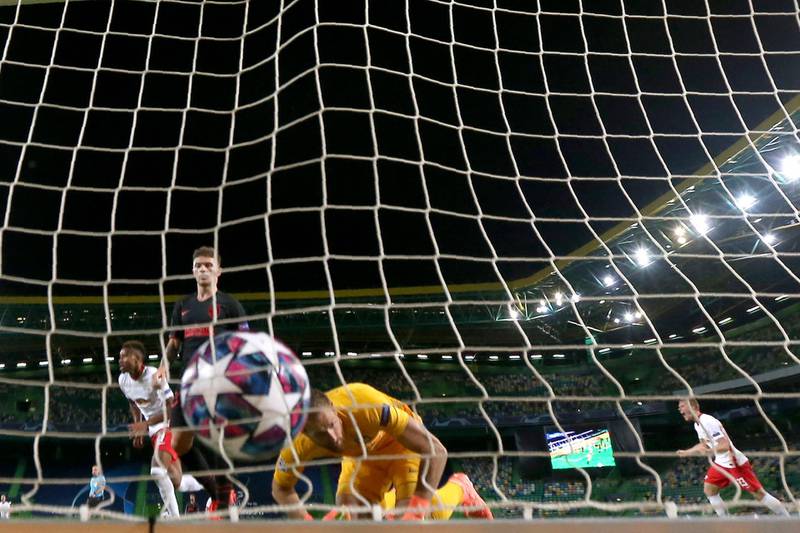 Atletico Madrid's goalkeeper Jan Oblak fails to stop a shot by Leipzig's Tyler Adams during the Champions League quarterfinal on Thursday. AP