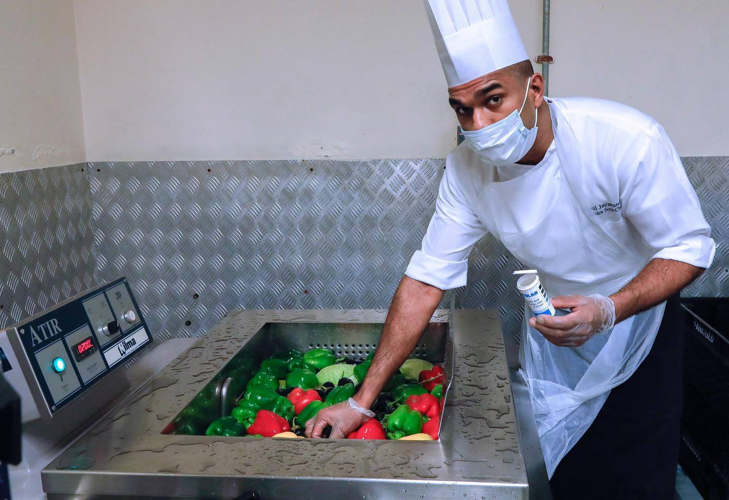 Abu Dhabi, United Arab Emirates, August 12, 2020.   Media Tour at The Westin Abu Dhabi Golf Resort & Spa on how tourism officials are conducting the go safe certification for hotels against Covid-19.   Upul Jaysundra, a Junior Sous Chef makes sure all vegetables are thouroughly and safely washed using special solutions which are later checked by a paper color chart for satisfactory tolerances.Victor Besa /The NationalSection:  NAReporter:  Haneen Dajani
