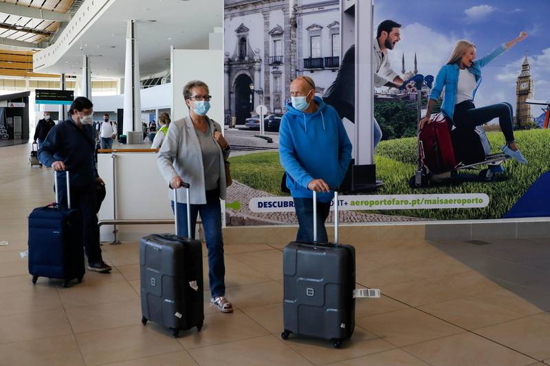 Passengers from Manchester make their way through Faro Airport in Portugal. Reuters