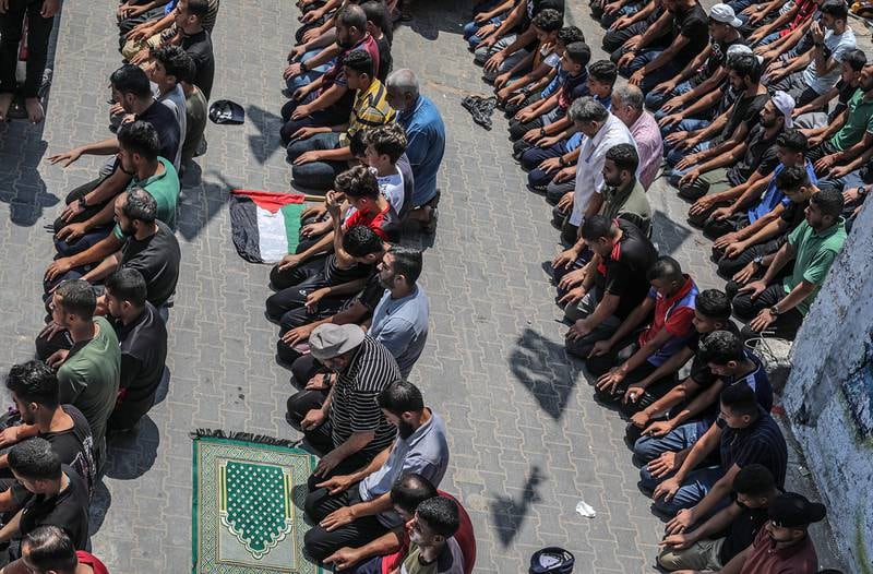 Palestinians attend the funeral of Yasser Al Nabhin and his three children at Al Bureije refugee camp in the central Gaza Strip. EPA