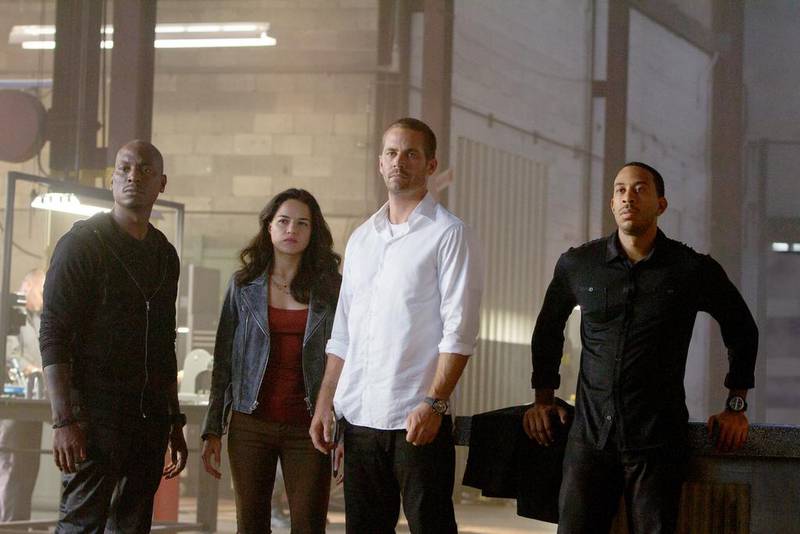 From left, Furious 7 cast members Tyrese Gibson, Michelle Rodriguez, Paul Walker and Chris 'Ludacris' Bridges. Photos courtesy Universal Pictures