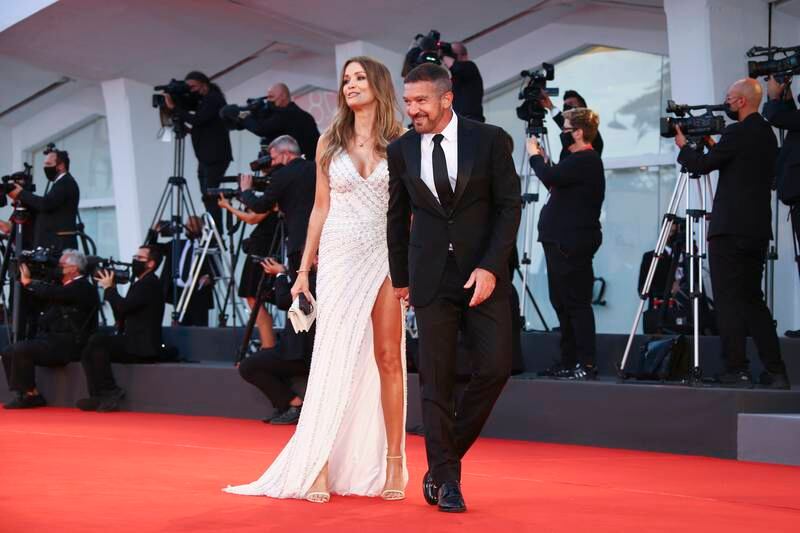 Antonio Banderas, right, and Nicole Kimpel pose for photographers at the premiere for 'Official Competition' during the 78th edition of the Venice Film Festival. AP