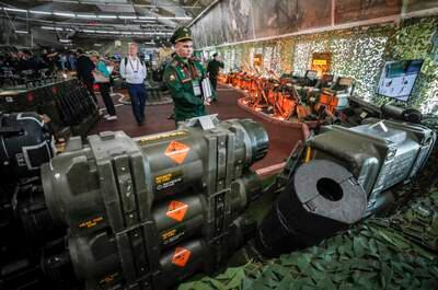 Visitors look at Ukrainian weapons