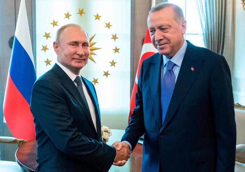 Russian President Vladimir Putin (L) and Turkey's President Recep Tayyip Erdogan shake hands during their meeting in Ankara on September 16, 2019. Turkish President Erdogan, Russian President Putin and Iranian President Rouhani are in Ankara for a trilateral meeting on Syria. / AFP / POOL / Pavel Golovkin
