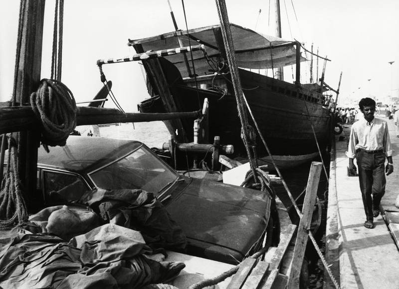 A car being loaded into an Arab Dhow in Dubai, in1971.  Shutterstock