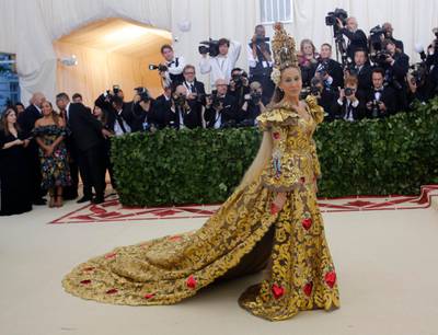 Sarah Jessica Parker, in gold Dolce & Gabbana, attends the Met Gala on May 7, 2018. Reuters