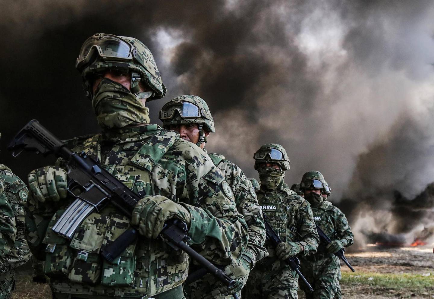 epaselect epa07036277 Members of Mexico's Marines participate in the destruction of drugs in Acapulco, Guerrero, Mexico, 20 September 2018. The Mexican Marines on 20 September burnt 4.7 ton of cocaine, 468 kg of marijuana and 54 psychoactive pills seized at the states of Guerrero and Morelos.  EPA/DAVID GUZMAN