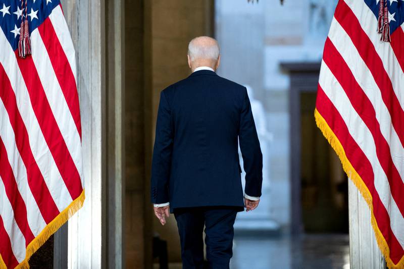 US President Joe Biden leaves after a speech marking the first anniversary of the US Capitol riots by supporters of former president Donald Trump, in Washington, DC. Reuters