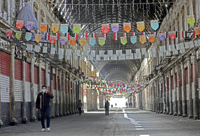 Only a few people walk in the century-old covered bazaar of Hamidiya in Syria's capital Damascus on March 24, 2020, after measures were taken by the authorities to fight the novel coronavirus pandemic. - Across much of the Syrian capital, with squares and markets once thronging with people even during the war, are now almost entirely empty.
Five cases of COVID-19 have been reported in the country since Sunday, and the authorities have ordered all non-essential businesses closed. (Photo by LOUAI BESHARA / AFP)