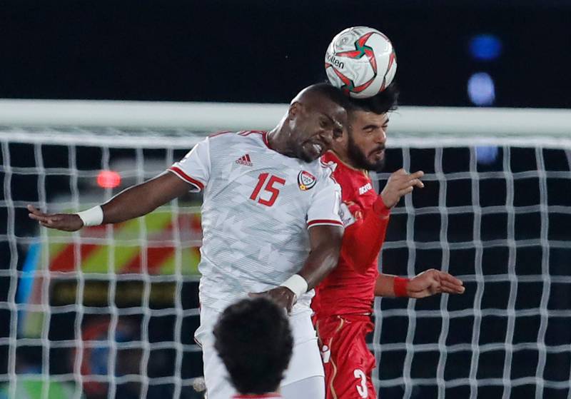 Al Hamadi, left, and Bahrain's defender Walled Al Haayam challenge for the ball. AP Photo