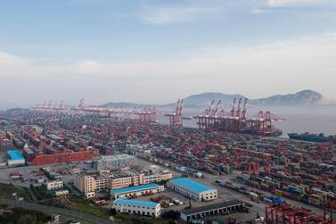 Yangshan port in Shanghai. China's economic growth slowed as trade war starts to bite. AP