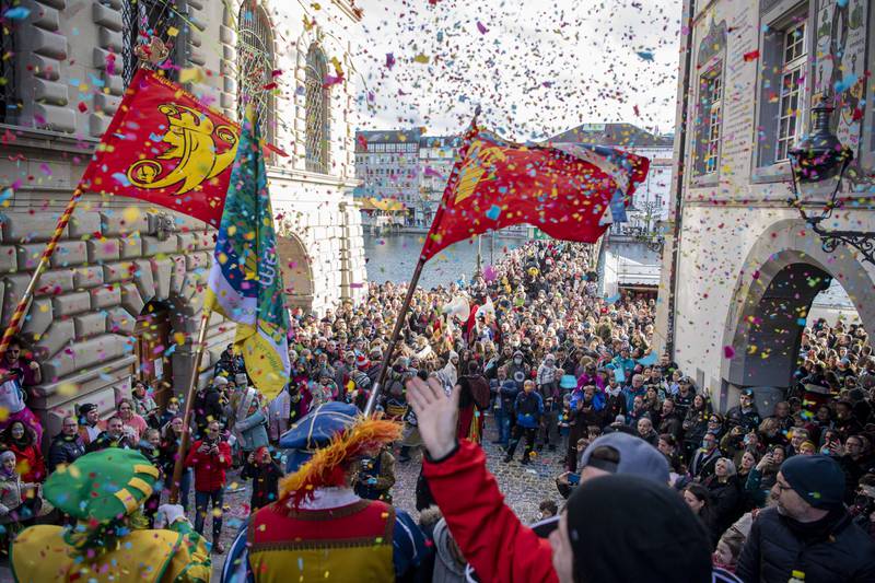 People take part in a parade during the traditional carnival market in Lucerne, Switzerland. AP