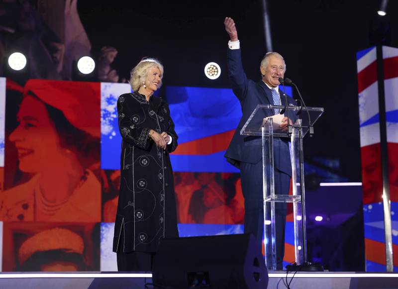 Prince Charles and his wife Camilla, wearing a wool and cashmere blend robe by Saudi designer Yahya Al Bishri, on stage during the platinum jubilee concert on June 4, 2022. AP 