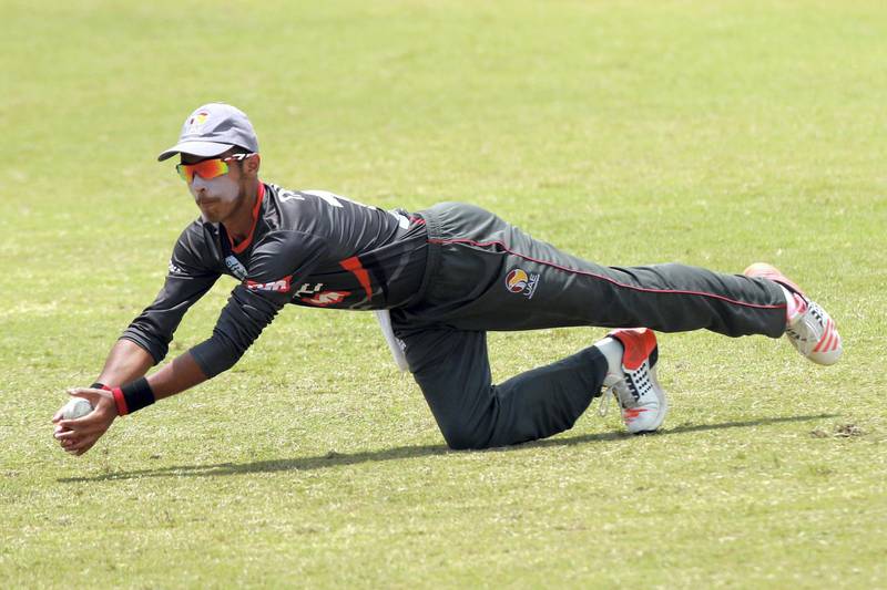 KUALA LUMPUR, MALAYSIA - OCTOBER 05: Ansh Tandon of UAE catches the ball during the 2018 Under-19 Cricket World Cup qualification Division 2 semi final match between Malaysia and United Arab Emirates at the Kinrara Academy Cricket Oval on October 5, 2016 in Kuala Lumpur, Malaysia.  (Photo by Stanley Chou/Getty Images)