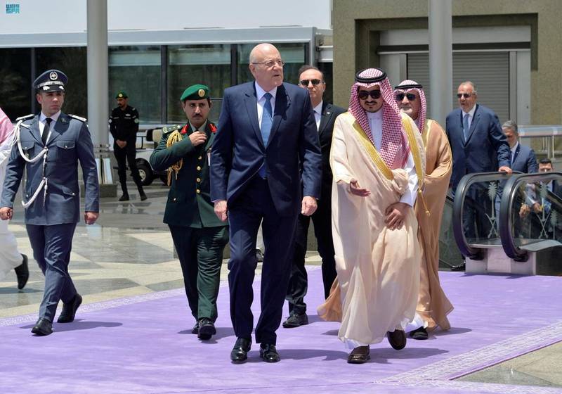 Lebanese Prime Minister Najib Mikati is received by Prince Badr as he arrives in Jeddah. Reuters