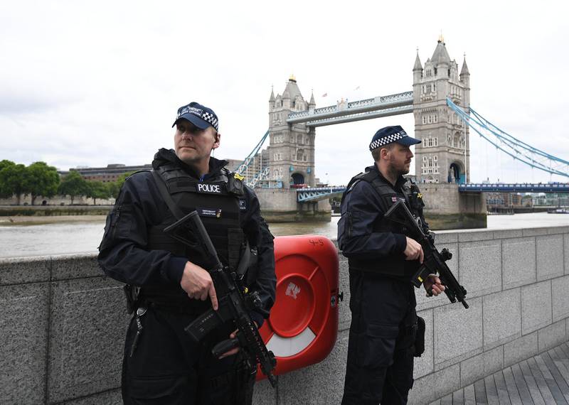 epa06369453 (FILE) - British police on dutyl during a vigil for the victims of the London Bridge terror attacks by the City Hall in London, Britain, 05 June 2017, (reissued 05 December 2017). Media reports on 05 December 2017 state that the report by David Anderson QC, a former terrorism law reviewer asked by the British Home Secretary to audit internal MI5 and police reviews, is published on 05 December 2017. The terror attacks in 2017 - at Manchester Arena, London Bridge, Finsbury Park and Westminster - has placed the spotlight on the British security services. The British internal security service MI5 and police launched internal reviews following the atrocities between March and June 2017 and the findings of the reviews looking at intelligence handling by the organisations are to be seen in the review published by the  Home Secretary.  EPA/FACUNDO ARRIZABALAGA *** Local Caption *** 53568746