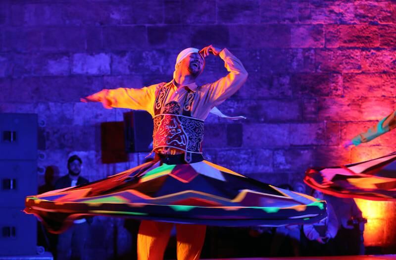 Egyptians members of the Tanoura Dance Troupe perform during Ramadan at the Ghouri complex, in Islamic Cairo, Egypt. EPA