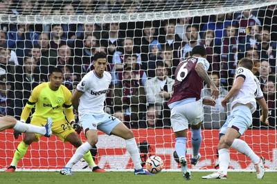 Aston Villa's Douglas Luiz, second from right, scores his side's opening goal. AP 