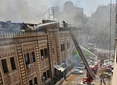 Firefighters put out the blaze at Egypt's Ministry of Religious Endowment in central Cairo on Saturday. Reuters