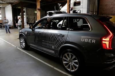 FILE  - In this Dec. 13, 2016 file photo, an Uber driverless car is displayed in a garage in San Francisco. Uber suspended all of its self-driving testing Monday, March 19, 2018, after what is believed to be the first fatal pedestrian crash involving the vehicles. The testing has been going on for months in the Phoenix area, Pittsburgh, San Francisco and Toronto as automakers and technology companies compete to be the first with the technology. Uber's testing was halted after police in a Phoenix suburb said one of its self-driving vehicles struck and killed a pedestrian overnight Sunday. (AP Photo/Eric Risberg, File)