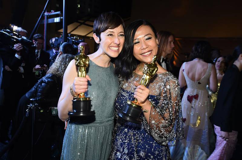 Best Animated Short Film winners for 'Bao' Domee Shi and Becky Neiman-Cobb with their Oscars. AFP