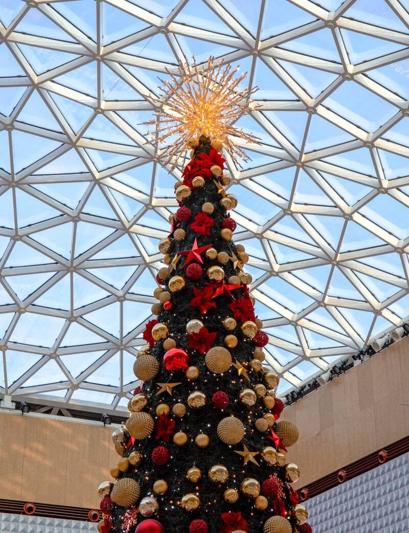 The Christmas tree festooned with decorations at Yas Mall's Town Square. Victor Besa / The National