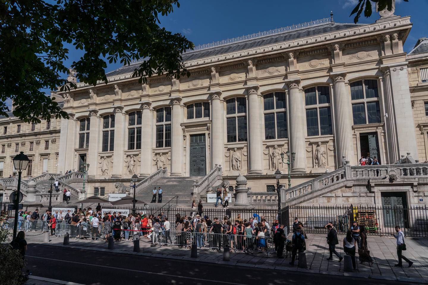 Families of victims, journalists, and lawyers attend the Palais de Justice in Paris.