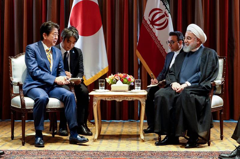 President Hassan Rouhani, right, meets Japanese Prime Minister Shinzo Abe, left, on the sideline of the United Nations General Assembly at the United Nations.  AP